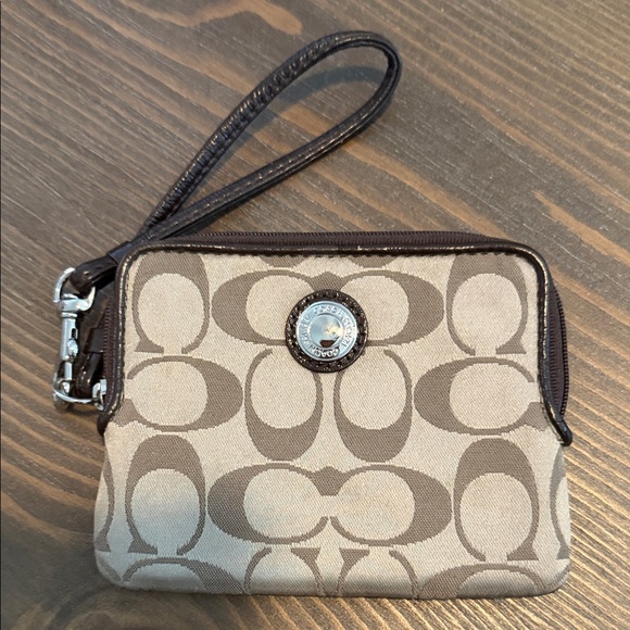 Coach Handbags - Coach Tan and Brown Signature Canvas Wristlet with Logo Medallion